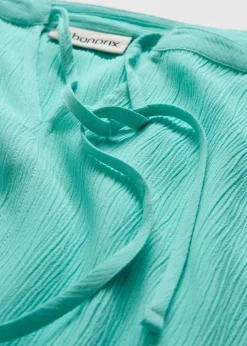 Blouse à manches papillon