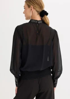 Blouse en tulle fin avec empiècements à sequins