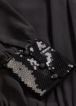 Blouse en tulle fin avec empiècements à sequins