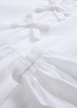 Blouse ornée de nœuds