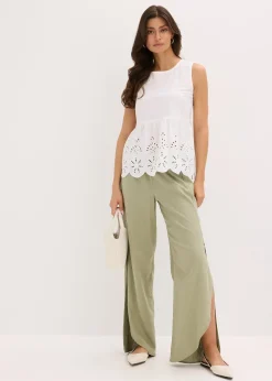 Blouse sans manches avec broderies anglaises, fendue sur les côtés