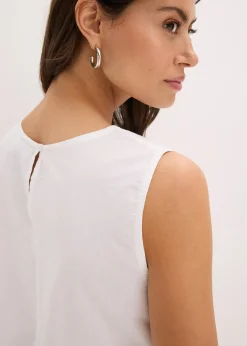 Blouse sans manches avec broderies anglaises, fendue sur les côtés