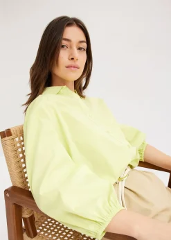 Chemisier court devant, long derrière, manches ballon