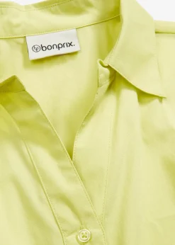 Chemisier court devant, long derrière, manches ballon