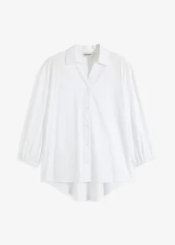 Chemisier court devant, long derrière, manches ballon