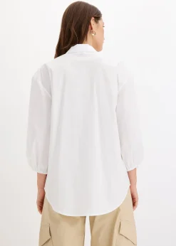 Chemisier court devant, long derrière, manches ballon