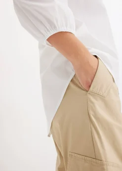 Chemisier court devant, long derrière, manches ballon