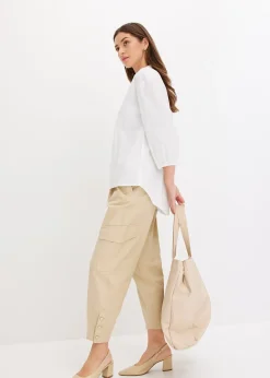 Chemisier court devant, long derrière, manches ballon