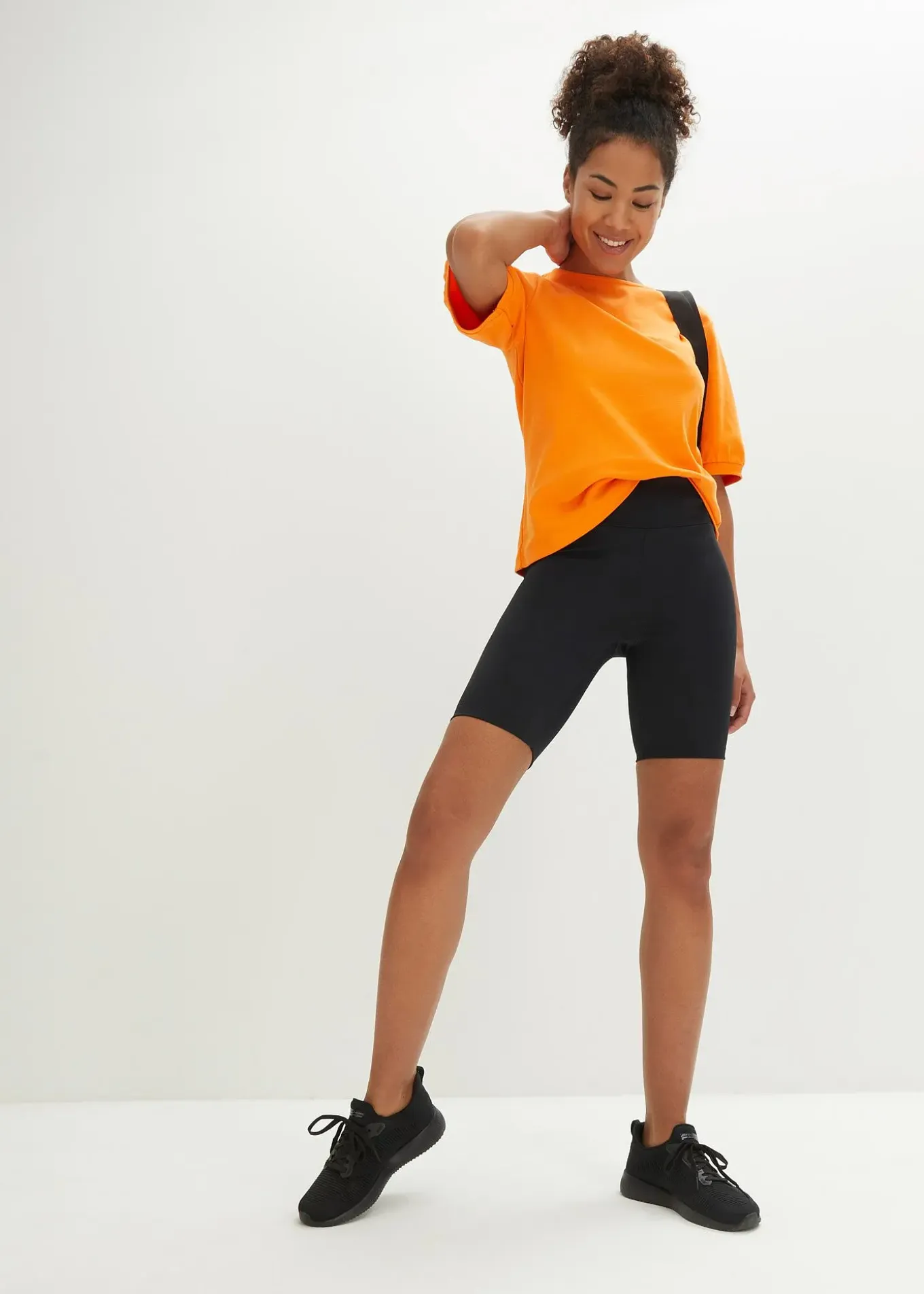 Cycliste fonctionnel avec poche dissimulée dans le dos, longueur bermuda