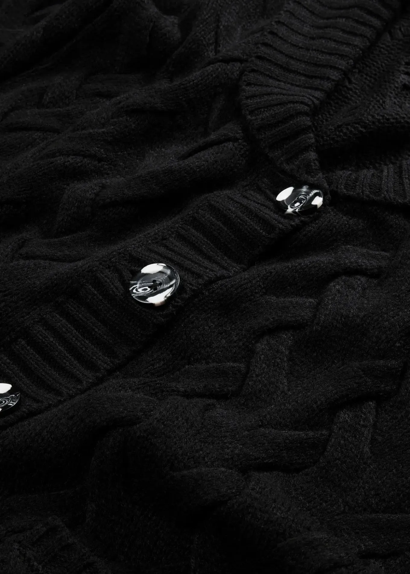 Gilet en maille à col châle et motif torsadé