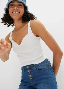 Jean pattes d’éph avec ourlets effilochés