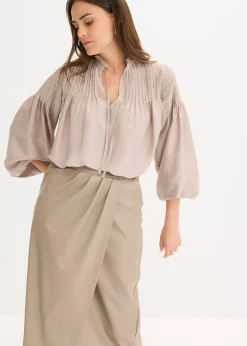 Jupe portefeuille enduite, longueur midi