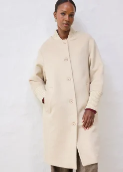 Manteau à empiècement en maille