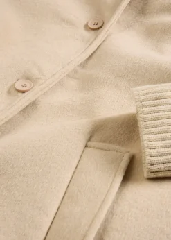 Manteau à empiècement en maille