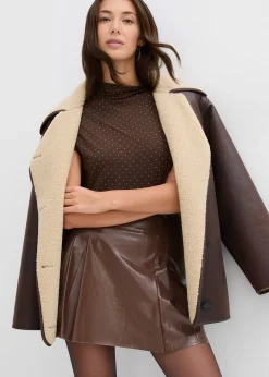 Mini-jupe enduite à plis creux