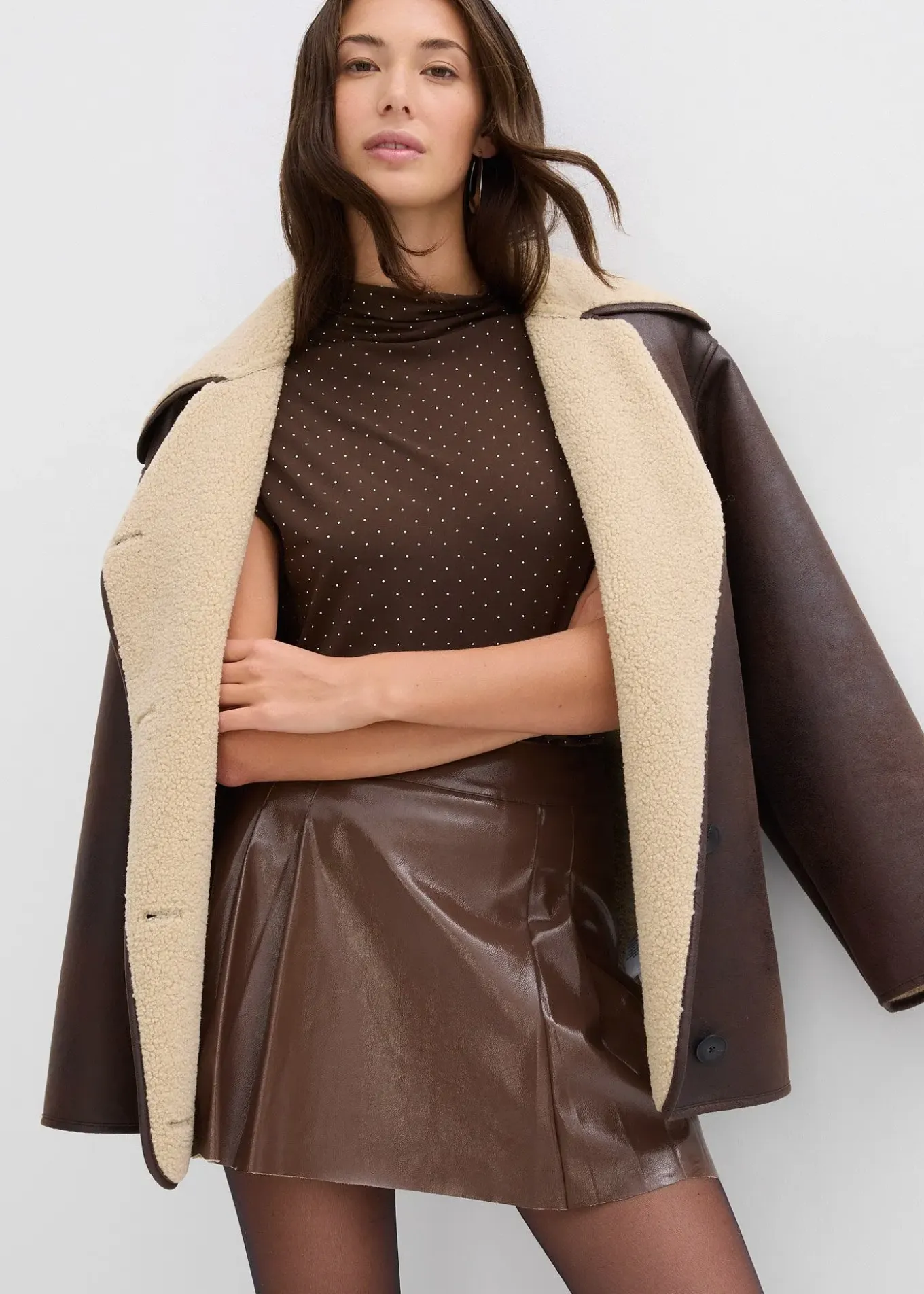 Mini-jupe enduite à plis creux