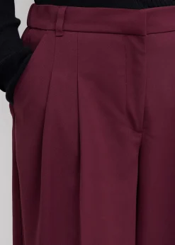 Pantalon à pinces, taille élastiquée et fente