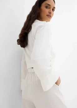 Pantalon avec bouton décoratif