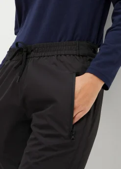 Pantalon de pluie ultra-léger à taille élastiquée avec zip sur le côté, imperméable