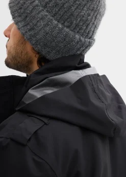 Parka technique imperméable à capuche enroulable et épaulettes