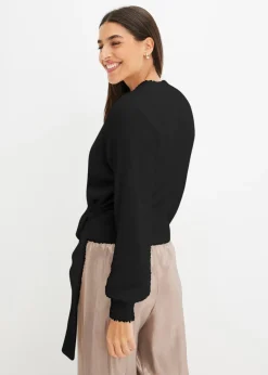 Pull cache-cœur avec accessoire