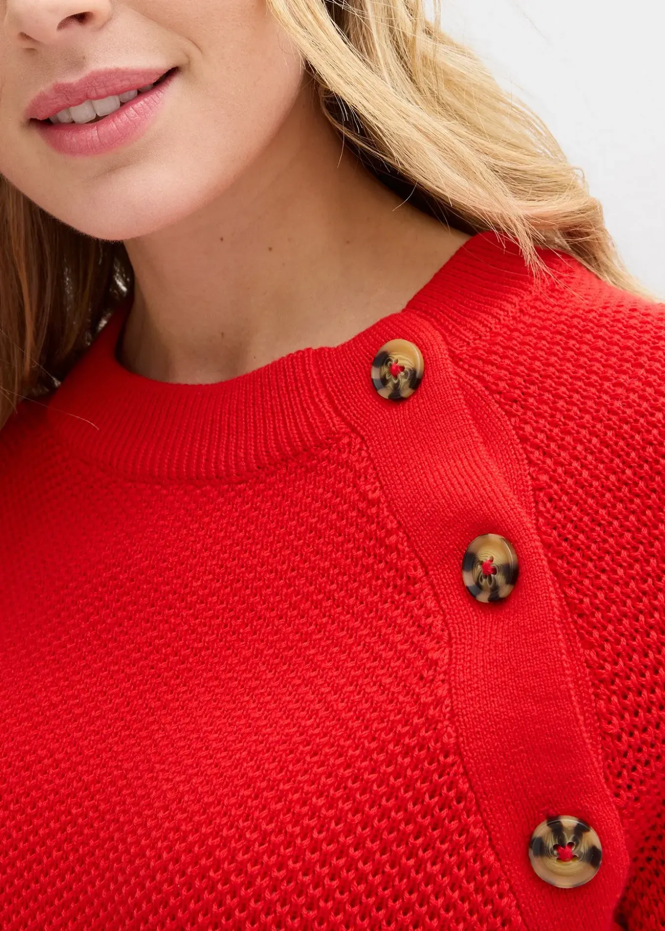 Pull en grosse maille avec patte de boutonnage