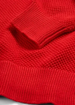 Pull en grosse maille avec patte de boutonnage