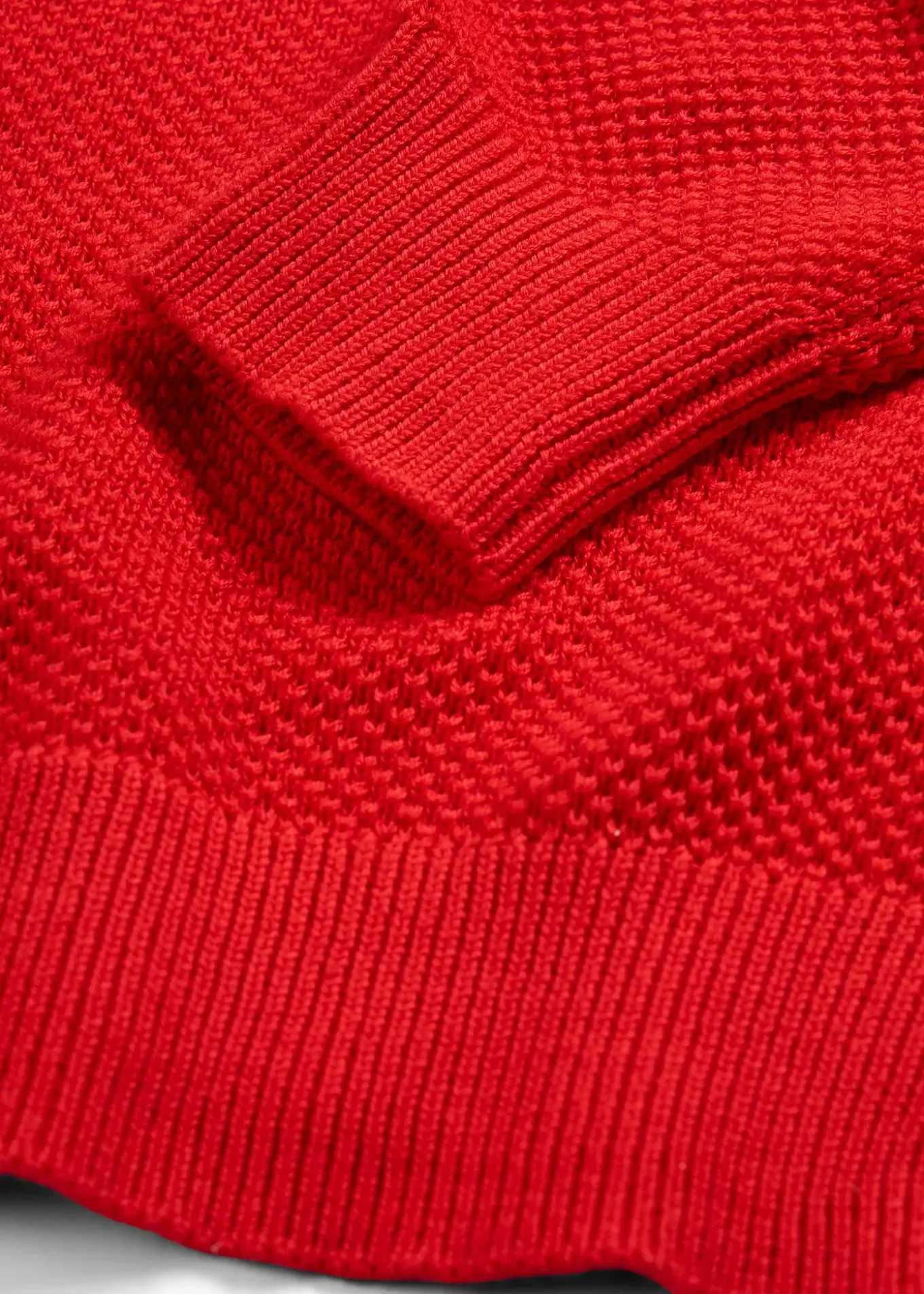 Pull en grosse maille avec patte de boutonnage