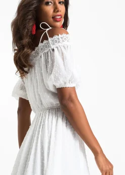 Robe à bretelles et base asymétrique