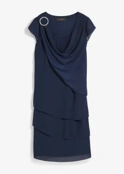 Robe courte look superposé avec accessoire sur l’épaule