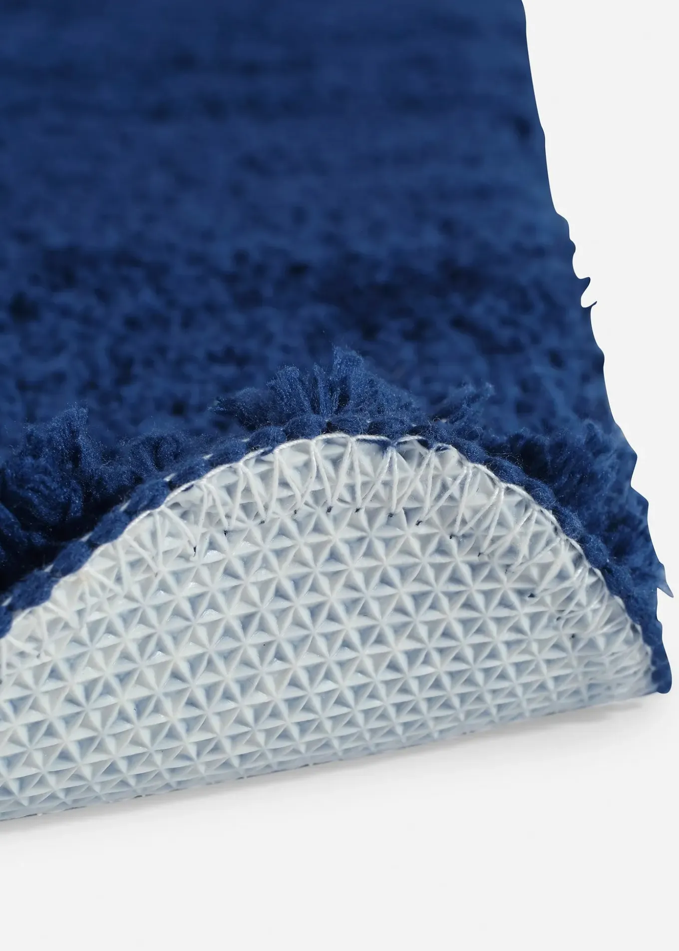 Tapis de bain tufté uni et haut