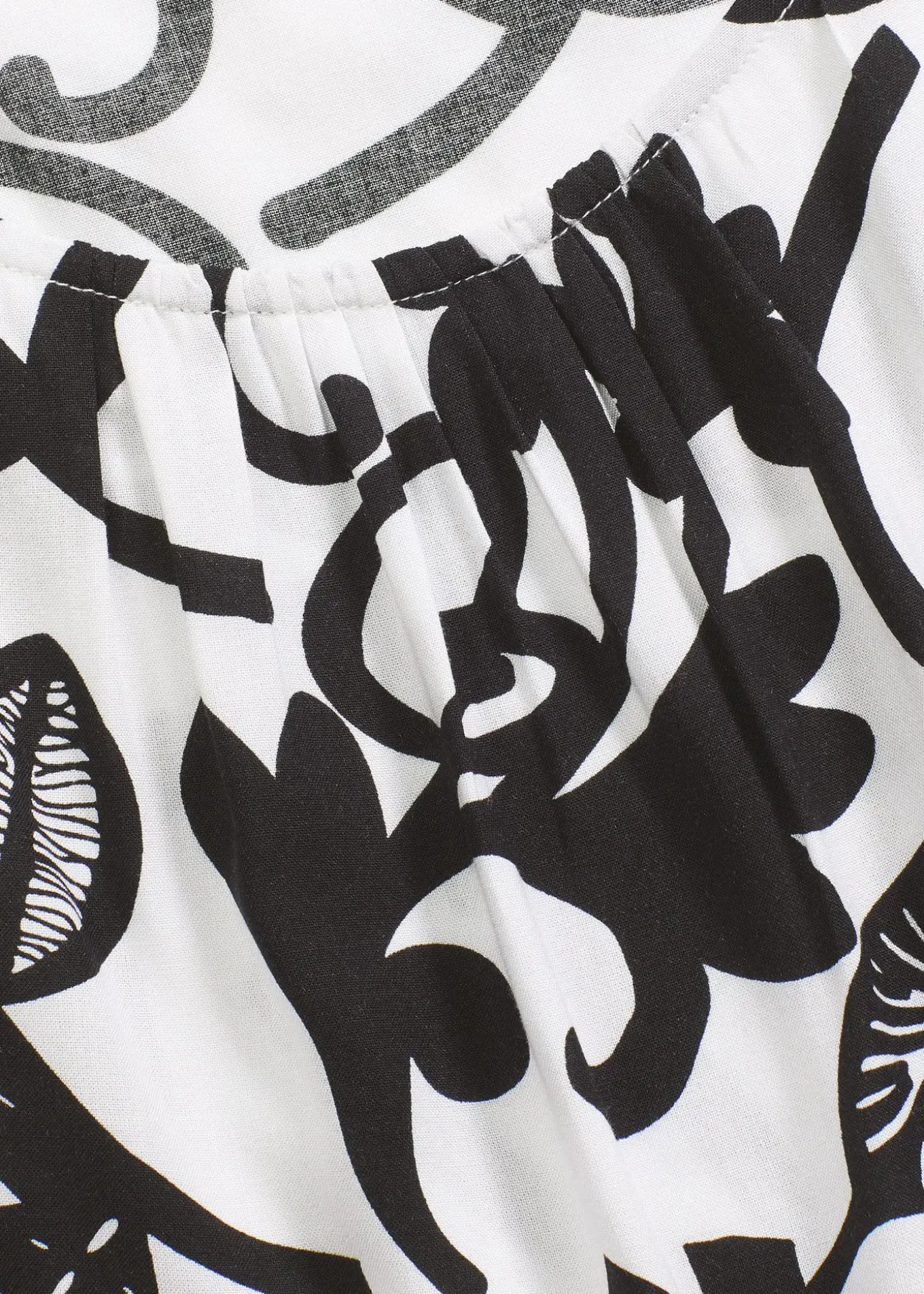 Top court sans manches en viscose fluide