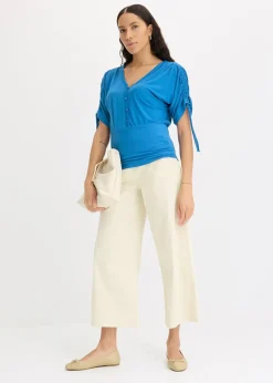 T-shirt à boutons décoratifs