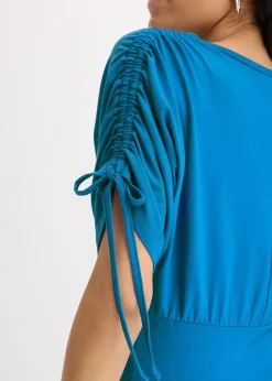 T-shirt à boutons décoratifs