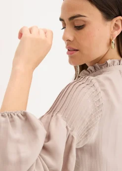 Tunique en satin brillant avec plis religieuse