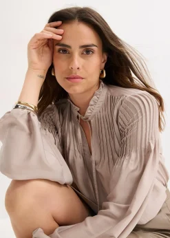 Tunique en satin brillant avec plis religieuse