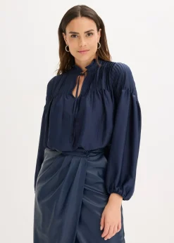 Tunique en satin brillant avec plis religieuse