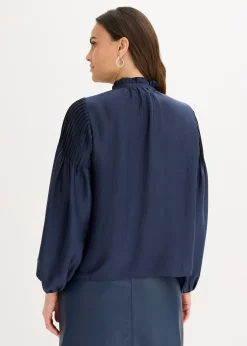 Tunique en satin brillant avec plis religieuse