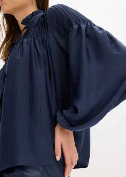 Tunique en satin brillant avec plis religieuse