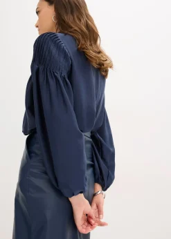 Tunique en satin brillant avec plis religieuse