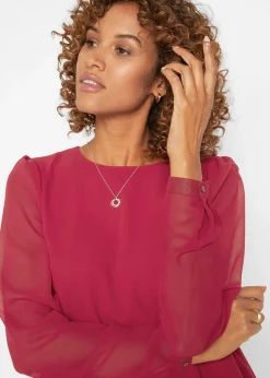 Tunique plus longue derrière