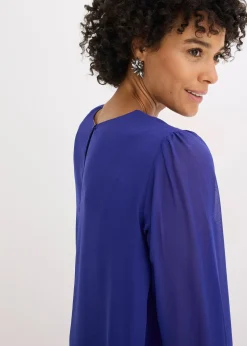 Tunique plus longue derrière