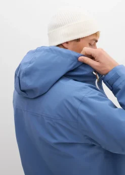 Veste imperméable à capuche et détails enduits
